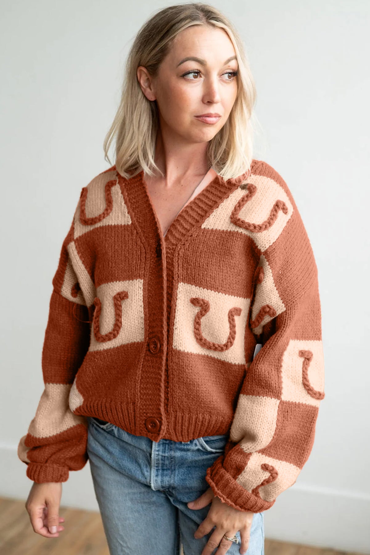 Women's Western horseshoe print plaid knit cardigan with V-neckline, ribbed cuffs, and button front