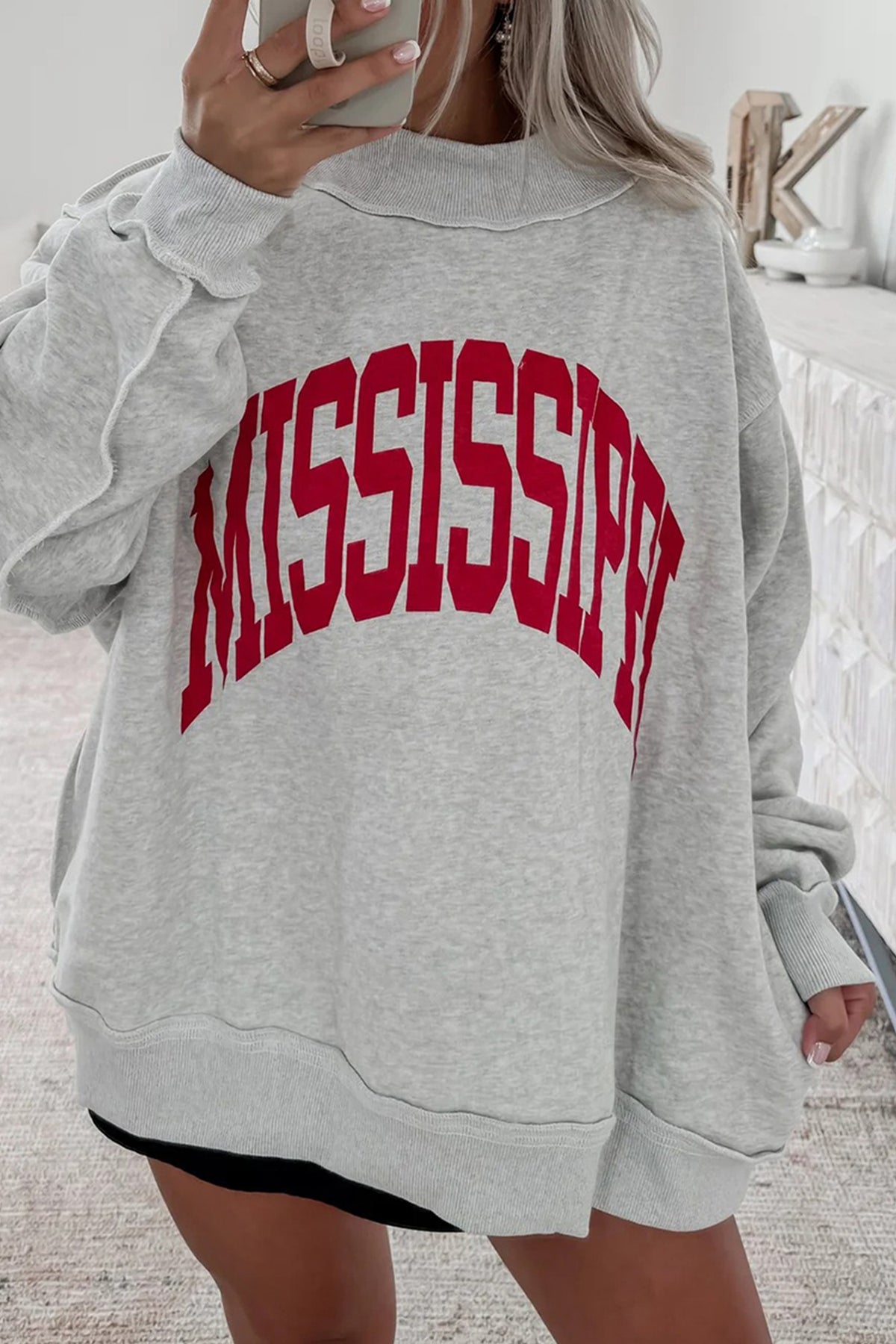 Women's reversible Mississippi Ole Miss sweatshirt with MS and MISSISSIPPI graphics and oversized mock neck fit
