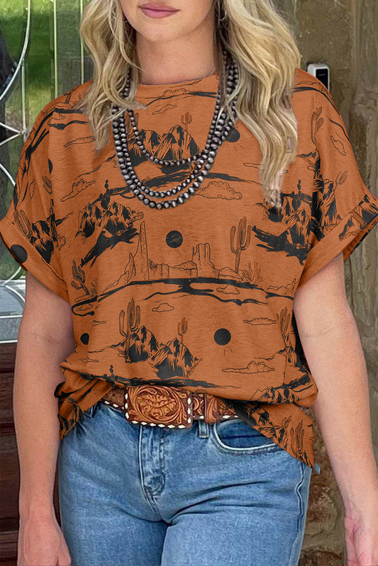 Person wearing a brown western graphic t-shirt and blue jeans with a belt.