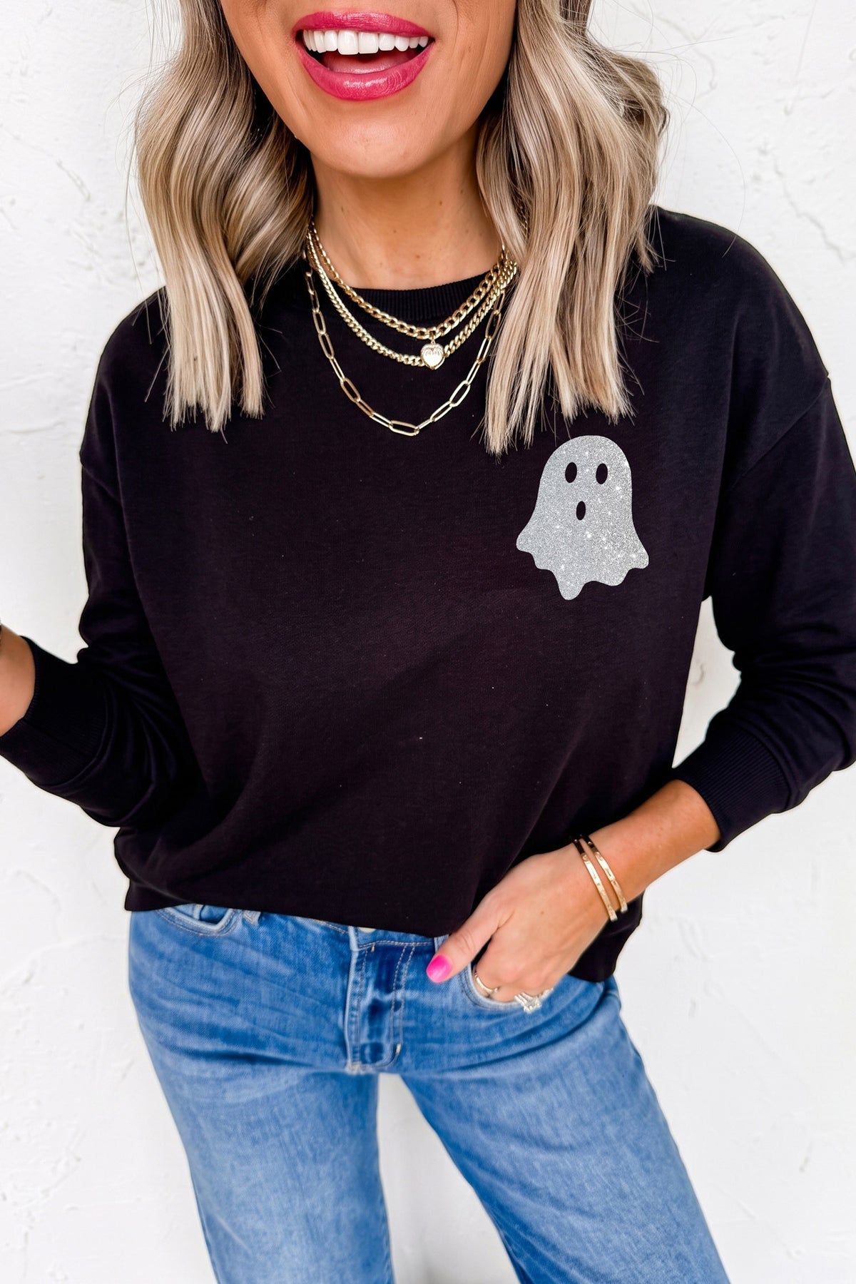 Women's black long sleeve Halloween T-shirt with glitter ghost graphic on the chest