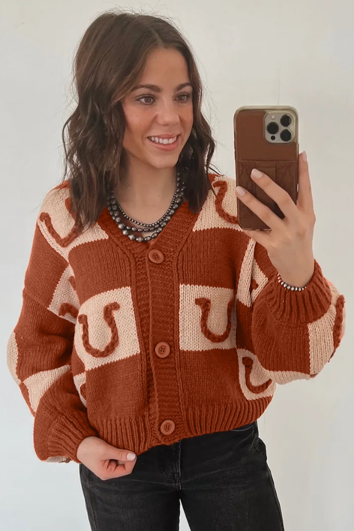 Women's Western horseshoe print plaid knit cardigan with V-neckline, ribbed cuffs, and button front