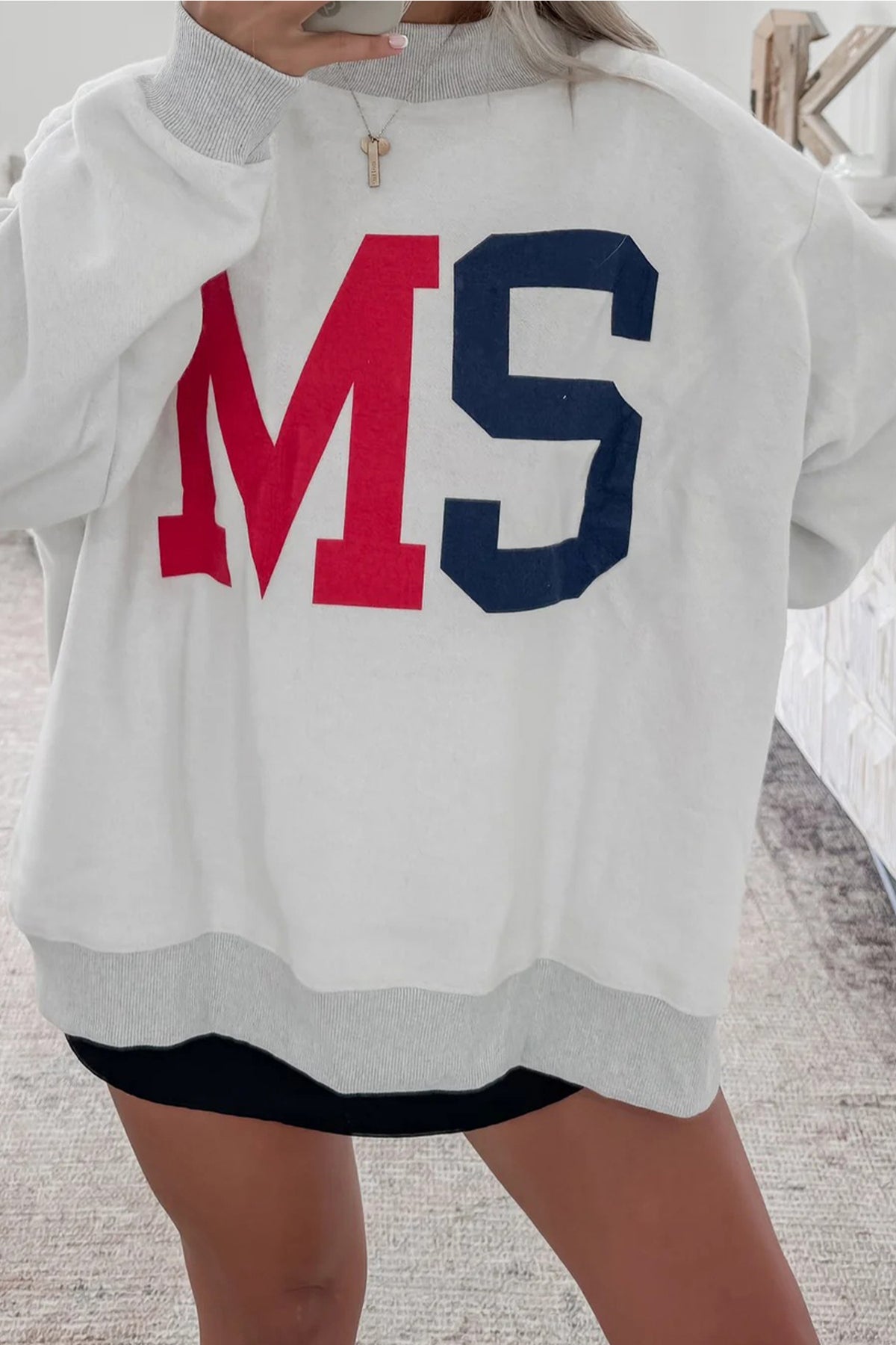 Women's reversible Mississippi Ole Miss sweatshirt with MS and MISSISSIPPI graphics and oversized mock neck fit